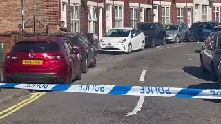 Serious police incident sees road closed with blue car smashed up in view