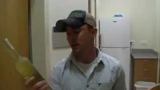 Butane demonstrates how to open wine without a cork screw