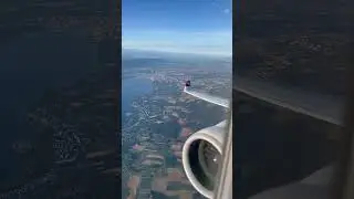 Climbing over Lausanne, looking back at Geneva and Lake Geneva from Swiss Airbus 220