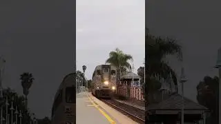 AMTK 6907 quills on past Carlsbad Village with a friendly engineer