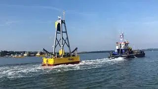 AMOG Wave Energy Converter being towed away from Pembroke Dock