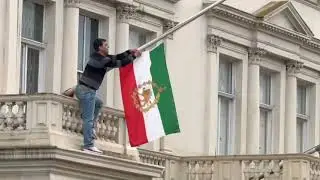 Anti-Government Protester Takes Down Iranian Flag at London Embassy