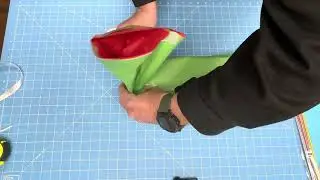 Fancy box wrapping with tissue paper with Ocean Tides tissue paper. Red white and green gift wrap. 
