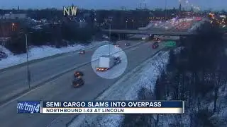 Semi driver cited for hitting overpass