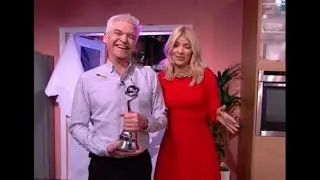 Holly Willoughby flaunts sizzling curves in plunging black gown