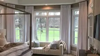 Somfy Motorized Draperies and Shades in a Bay Window