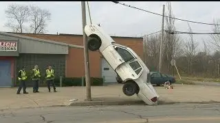 Car ends up vertical on utility pole wire in Youngstown