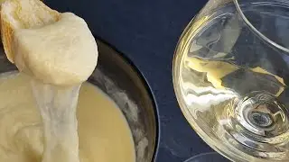 Cheesy Delight: Swiss Fondue with Garlic Baguette and White Wine