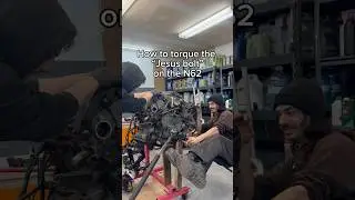 Torquing the crank bolt on BMW N62 engine.