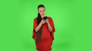 Pretty Young Woman Is Texting on Her Phone  Green Screen Video Effect | No Copyright Stock Video