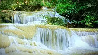 Magical turquoise cascade waterfall in thai jungle. Gentle water sounds for sleep, relax