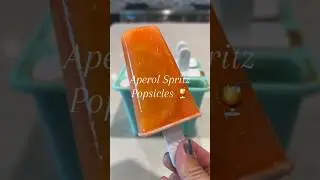 Chillin' in the sun with Aperol Spritz popsicles | Boozy Popsicles