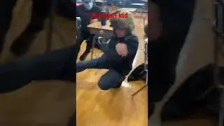Kid does Russian squat kick