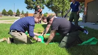 Media trains on deploying fire shelters at fire safety training