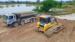 Nicely Skill Shantui DH17c2 bulldozer push soil rock with Team Hyundai dumping soil rock delete pond
