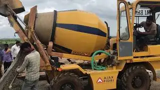 Making of concrete road with Transit mixer and screed vibrator