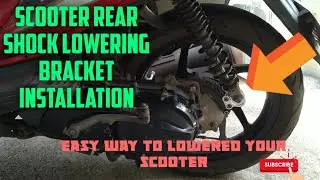 Scooter rear shock lowering bracket installation