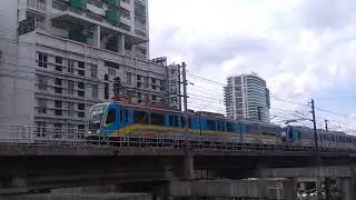 MRT 3 3100 series CN Dalian LRV meets CKD Tatra LRV  at Aurora Blvd Intersection.