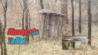 Appalachian mountains exploring  old out house a rock celler a well in  Appalachian holler Kentucky