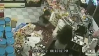 Clerk with gun stops knife-wielding robber