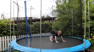 8 year old boy doing back-flip on trampoline