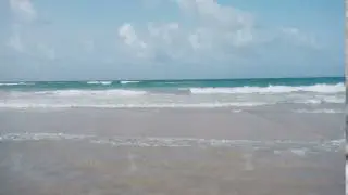 The blue sea washed a beautiful beach