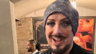 Boy George in Moulin Rouge- bows and stage door