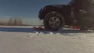 Off Road Consulting Maxtrax test in snow with log