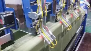 Auto. length cutting machine for multiple width towel fabrics