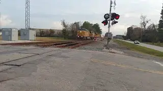 a long Union pacific mix Freight going by spring tx.