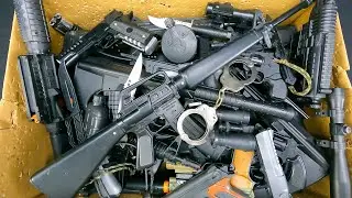 Box of Toy Realistic Black Color Guns, Bead Shooter And Capsule Explosion Guns