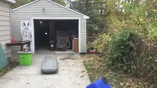 neighbor trespassing and putting junk (not his mower) on my property