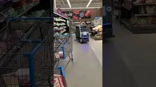 Automatic Floor Cleaner at Wal-mart running while customers are shopping