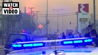 Firefighters and residents fight blaze in Athens