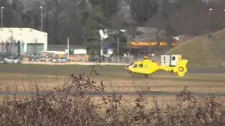 EAAA East Anglian Air Ambulance lands new angle 10Mar15 Cambridge UK 212p
