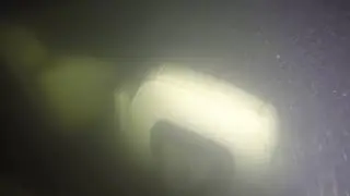 Video shows lift bags being attached to sunken boat before it's towed out of the water