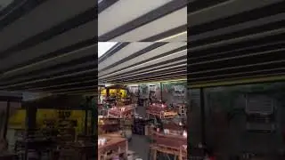 Electric folding canopy creates outdoor dining area #decor #roof #shade#outdoor