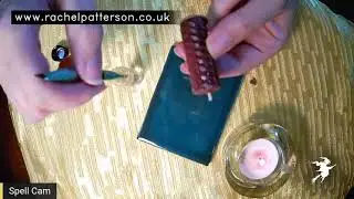 Coin and candle money spell