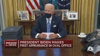 President Joe Biden signs his first executive orders
