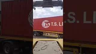 Use Reach Stacker to lift the materials and container van