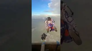 Human squirrel suit jumping from platform