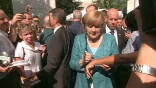 Merkel mingles with the public as Germany's government buildings open their doors