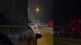 Nighttime Traffic on a Busy City Road, Capturing the Flow of Vehicles and Illuminated Structures