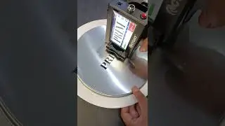 CYCJET Handheld inkjet printer marks logo on the surface of product with metal layer