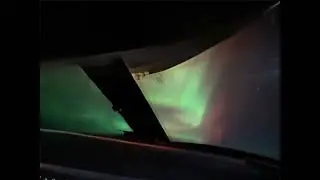 Northern light from the cockpit over the Atlantic Ocean