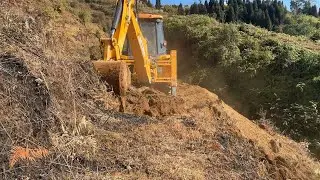 Cutting Hillside for New Mountain Road by a Slippery Deep Cliff with JCB Backhoe