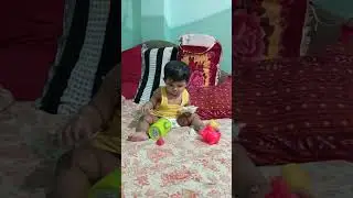 Continuous 5 minutes activities of a cute 9 months baby with swinging Yoga