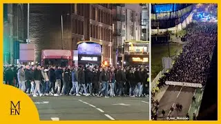 Feyenoord fans make themselves known as they walk to Man City