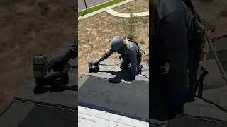 Roofer nailing shingles on the edge of 3 story house! 😲 #roofing #construction #homedecor