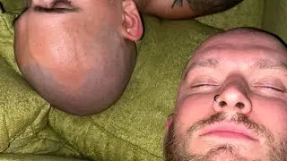 Two guys shaving each other and having fun